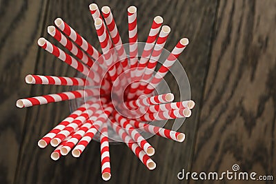 Vintage paper straws in glass on wood table Stock Photo