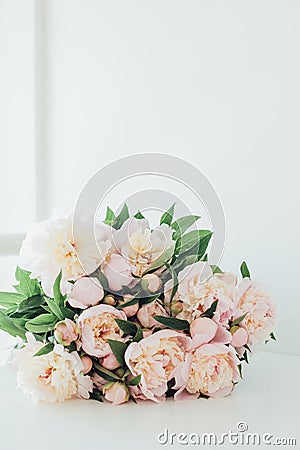 Vintage peony bouquet on white table Stock Photo