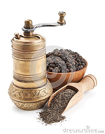 Vintage pepper mill and black peppercorn Stock Photo