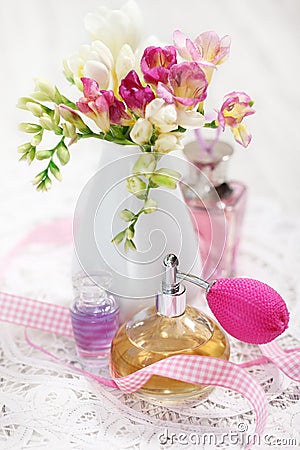 Vintage perfume bottles and flowers Stock Photo