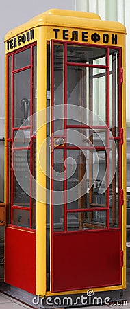 Vintage telephone booth painted in traditional colors Stock Photo