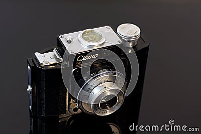 Vintage photo camera on the mirror table Editorial Stock Photo