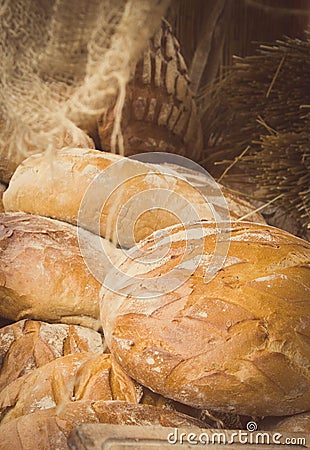 Vintage photo, Freshly baked traditional loaves of rye bread on stall Stock Photo