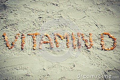 Vintage photo, Inscription vitamin D on sand at beach, summer time and healthy lifestyle Stock Photo