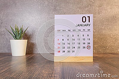 Vintage photo, January 27th. Date of 27 January on wooden cube calendar, copy space for text on board Stock Photo