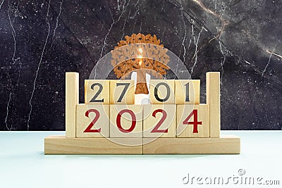 Vintage photo, January 27th. Date of 27 January on wooden cube calendar, copy space for text on board Stock Photo