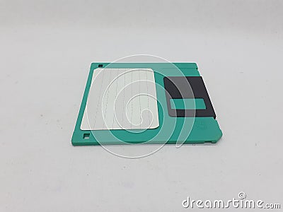 Vintage Photo Realistic Small Electronic Magnetic Floppy Disk for Old Computer Data Storage in White Isolated Background Stock Photo