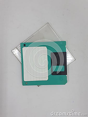 Vintage Photo Realistic Small Electronic Magnetic Floppy Disk for Old Computer Data Storage in White Isolated Background Stock Photo