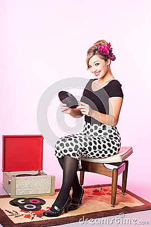 Vintage pinup style of cute blond with vinyl records Stock Photo