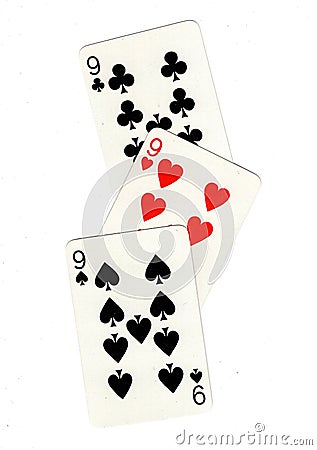 Vintage playing cards showing three nines. Stock Photo