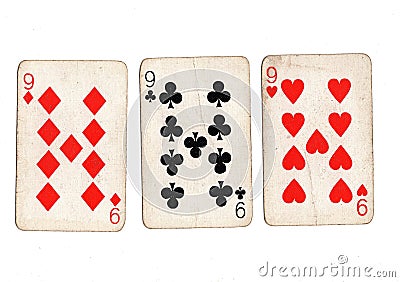 Vintage playing cards showing three nines. Stock Photo