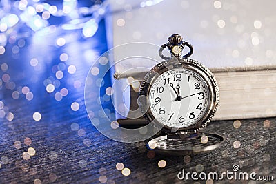 Vintage pocket watch with book Stock Photo