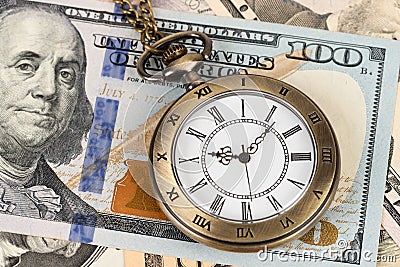 Vintage pocket watch clock on dollar banknote concept for money time value Stock Photo