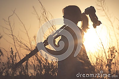 Vintage portrait of a young girl photographer working in the field of professional photographic equipment Stock Photo