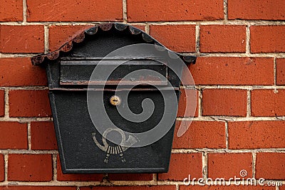 Vintage postbox on brick wall Stock Photo