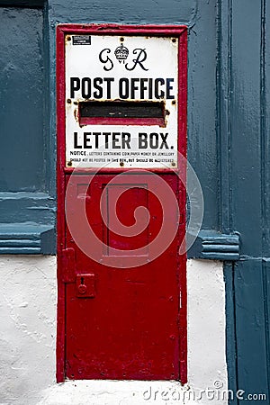 Vintage postbox in wall in seaside town in East Anglia Editorial Stock Photo