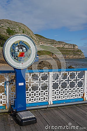 Vintage public weigh scale at the seaside Editorial Stock Photo