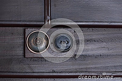 A Vintage put light switch on wooden interior wall Stock Photo