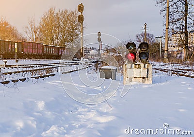 Vintage railway traffic light on an old snow covered railway station. Trains, rails, travel, abandoned Stock Photo