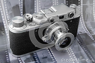 Vintage rangefinder camera over black and white film Stock Photo