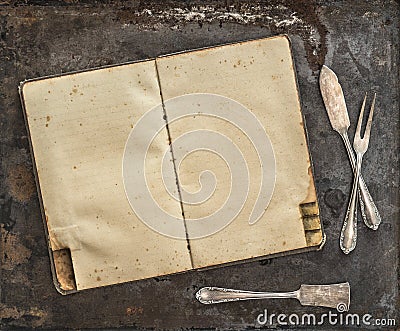 Vintage recipe book Antique silverware rustic background Stock Photo