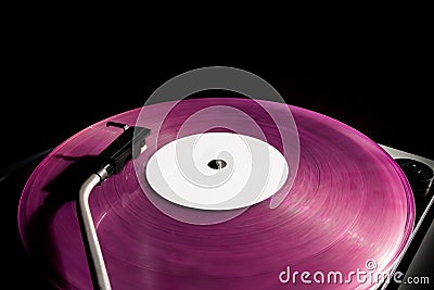 Vintage record player pink vinyl record black background old turntable Stock Photo