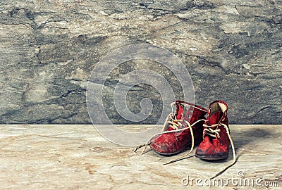 Vintage red baby shoes. retro style toned picture Stock Photo