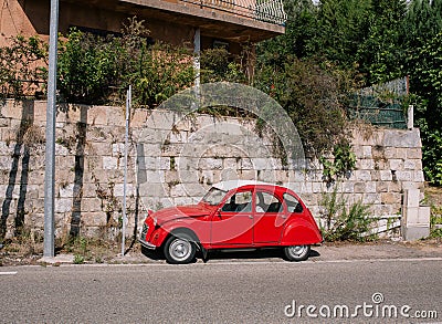 Vintage red car on the street in the south of Europe near the sea Editorial Stock Photo