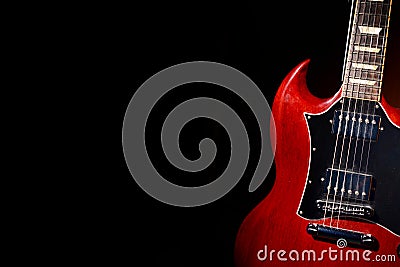 Vintage red electric guitar on moody dark background Stock Photo