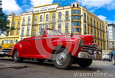 Vintage red Ford parked near a hotel in Havana Editorial Stock Photo