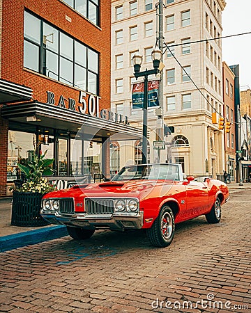 A vintage red Oldsmobile 442, in downtown Flint, Michigan Editorial Stock Photo