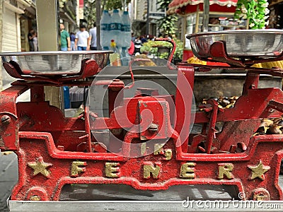 Vintage, red weighing scales on street corn stall, Istanbul, Turkey Editorial Stock Photo