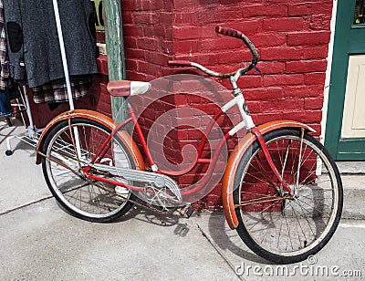 Vintage Red and White Girl's Bicycle Stock Photo