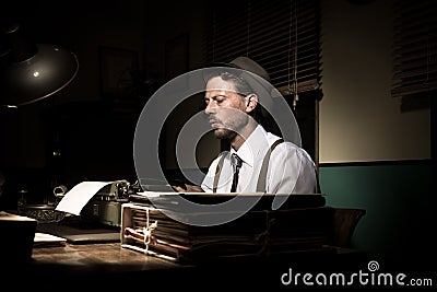 Vintage reporter working late at night Stock Photo