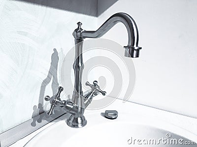 Vintage retro brass water tap faucet closeup on light background Stock Photo