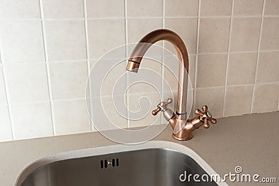 Vintage retro bronze water tap faucet Stock Photo