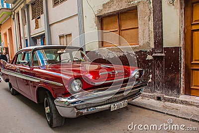 Vintage retro car red on a traditional street in the Old Havana area. Cuba Editorial Stock Photo