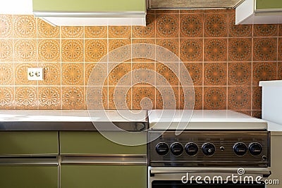 Vintage retro kitchen with orange pattern tiles, american retro kitchen home interior design 70's style Stock Photo