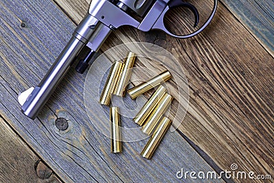 Vintage revolver Nagant with a rotating drum and the seven golden cartridges Stock Photo