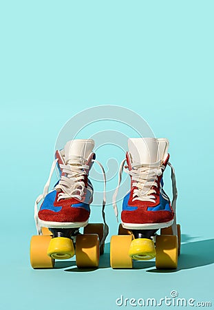 Vintage roller skates on blue backdrop Stock Photo