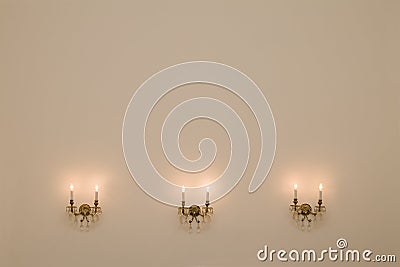 Vintage room with three antique wall lamps. Stock Photo