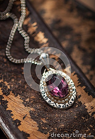 Vintage ruby pendant with chains Stock Photo