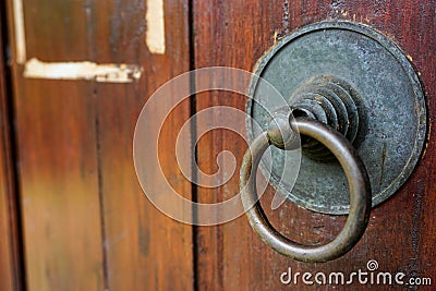 Vintage rusty doorknob on wooden classic door Stock Photo
