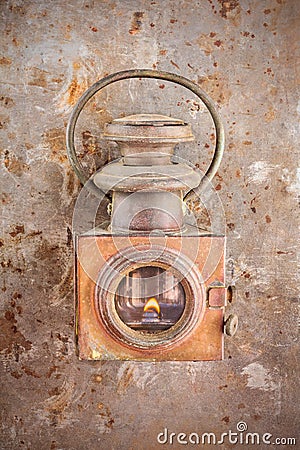 Vintage rusty lantern on a rusted steel background Stock Photo