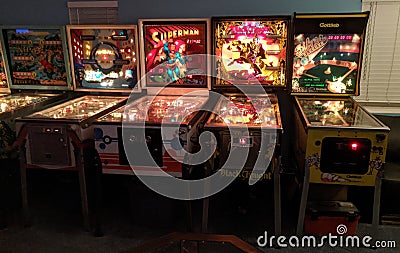 Vintage 70s-90s pinball machines in arcade Editorial Stock Photo