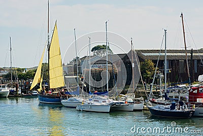 Vintage sailing boat ready to leave boatyard jetty Editorial Stock Photo