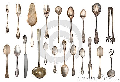 Vintage Silverware, antique spoons, forks, knives, ladle, cake shovels isolated on isolated white background. Antique silverware. Stock Photo
