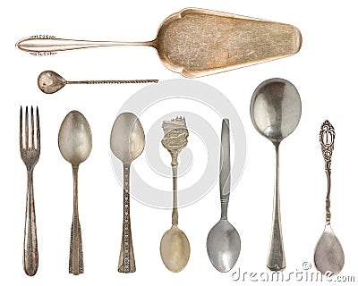 Vintage Silverware, antique spoons, knives, cake shovels isolated on isolated white background. Antique silverware. Retro Stock Photo
