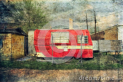 Vintage Small Red Camper Trailer and Clothesline Stock Photo