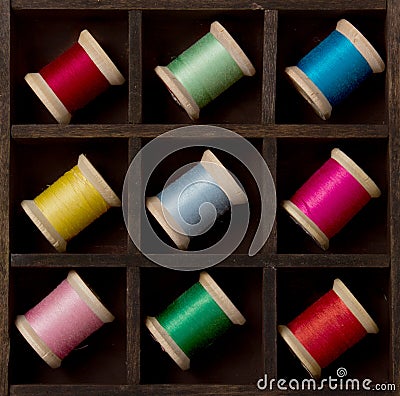 Vintage spools of thread in many colors Stock Photo